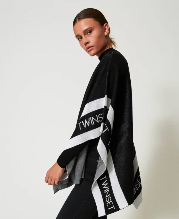poncho_en_maille_jacquard_1.webp Ponchos*TWINSET Milano Poncho En Maille Jacquard Avec Logo Noir