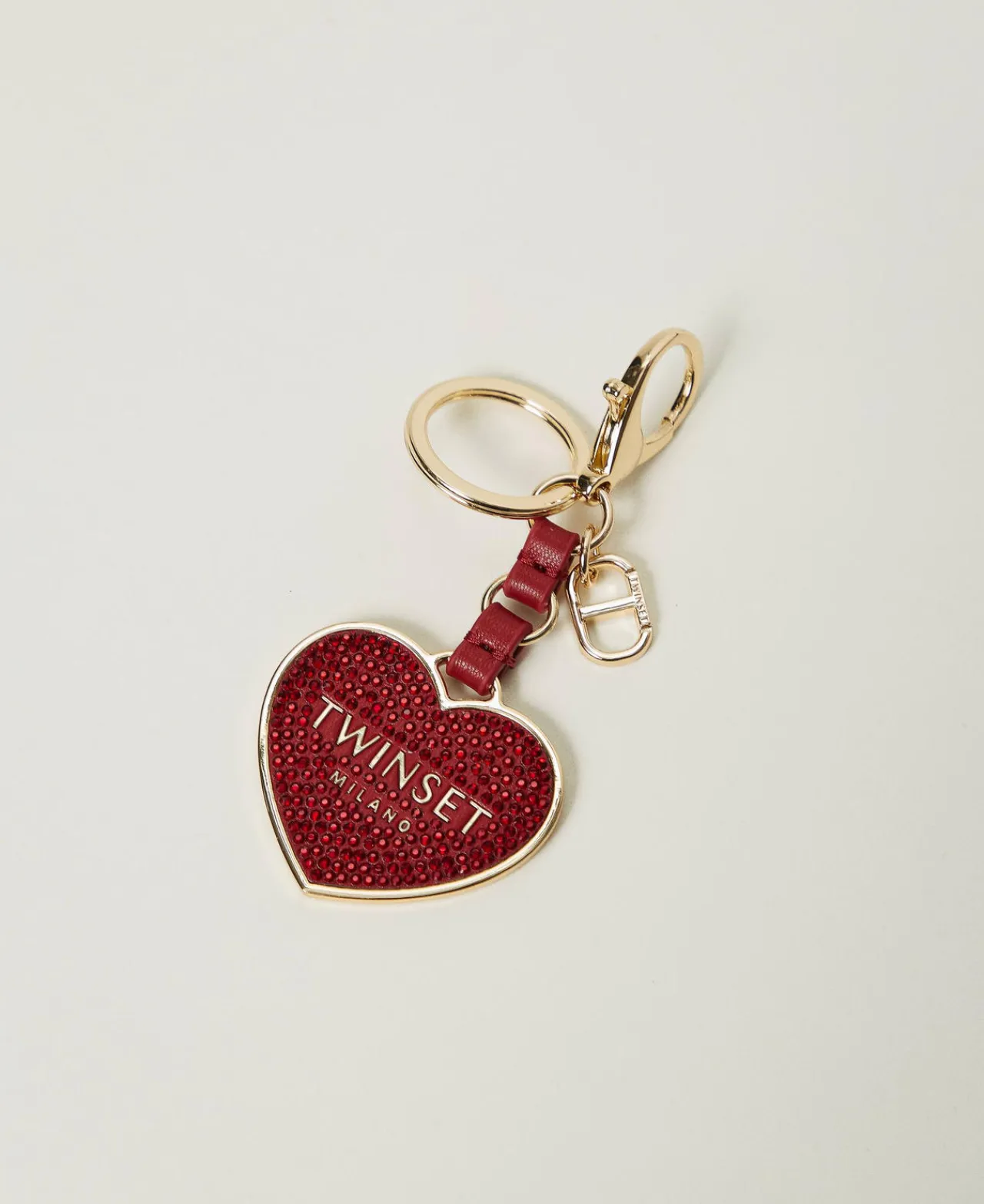 portecls_en_cur_avec_logo_0-1.webp Portefeuilles Et Porte-Clés*TWINSET Milano Porte-clés En Cœur Avec Logo Et Strass Rouge Vénitien